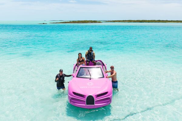 Drone shot of tourists in a pink jet car, Turks and Caicos.