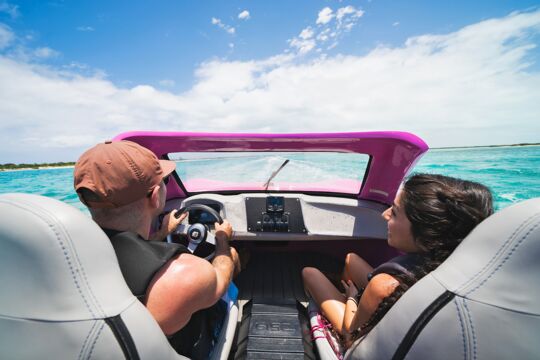 Couple riding in a jet car in Turks and Caicos.