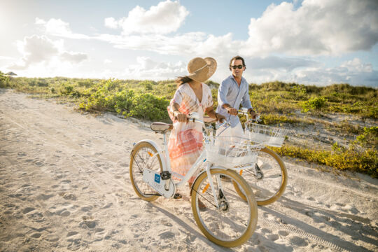 Couple with bicycles on Parrot Cay.