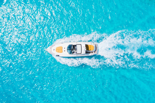Overhead view of a yacht cruising