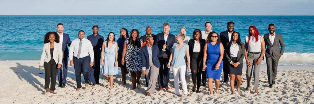 Team photo for a law firm on the beach in Turks and Caicos. 