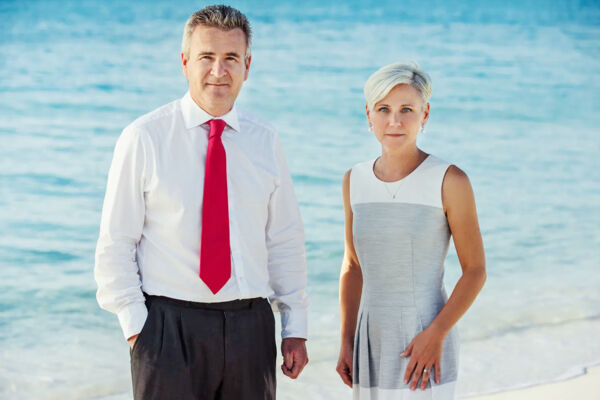 The senior partners at law firm Stanbrook Prudhoe on a Turks and Caicos beach.