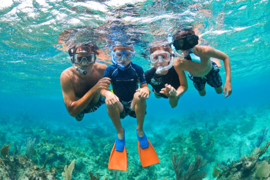 Family snorkeling in the Turks and Caicos Islands.