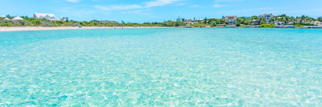 The view from the water of Taylor Bay and vacation rental villas