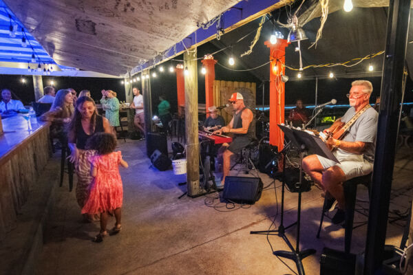 Little girl dancing to The Bar Band's music at a restaurant in Providenciales.