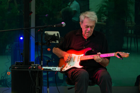 Solo guitarist performing at night in Turks and Caicos. 