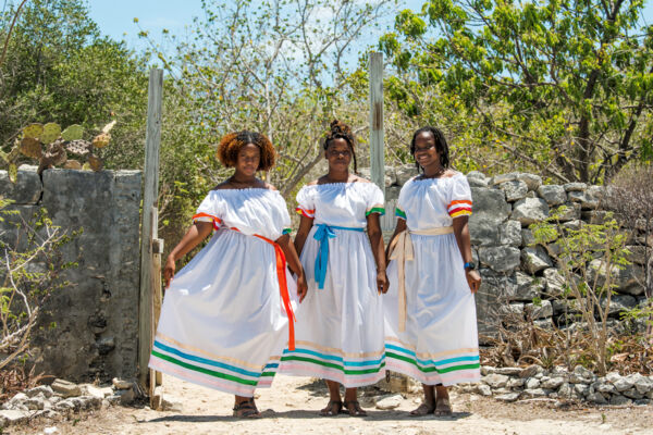 Women wearing the national costume of the Turks and Caicos Islands at Cheshire Hall.