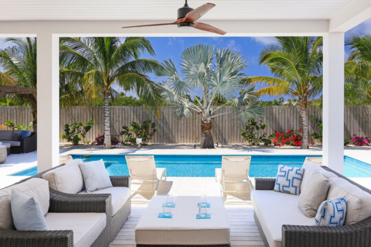 The outdoor covered lounging area of a luxury villa in Leeward, Providenciales. 