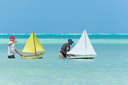 Competitors adjust the sails on their model sailboats at the 2014 Valentine's Day Cup. 