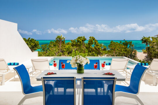 Outdoor dining table near a pool