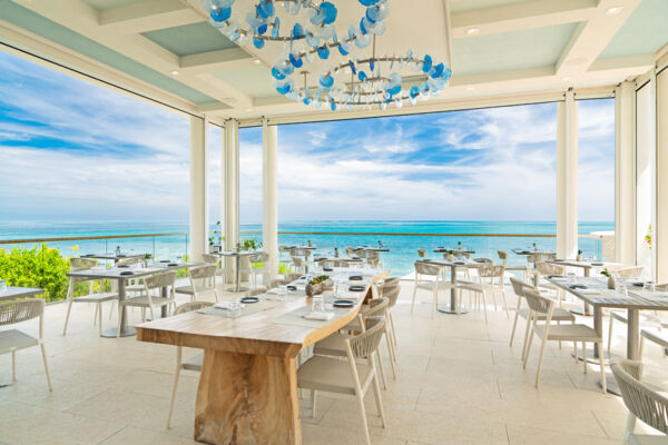 An elegant fine dining patio overlooking the turquoise ocean in Turks and Caicos.