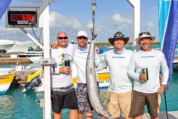 Fishermen posing with their catch in Turks and Caicos. 