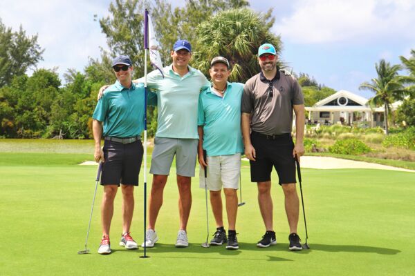 A team of golfers at the Wine Cellar Golf and Fishing Tournament in Turks and Caicos.