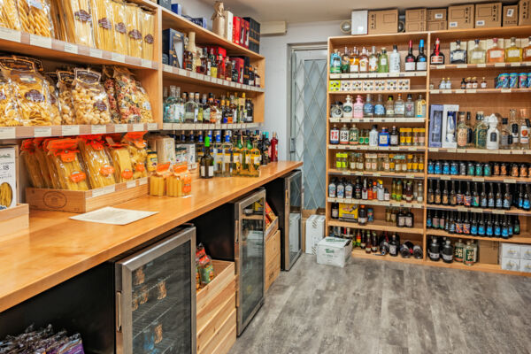 Shelves of pastas and liquors at the Wine Establishment, a specialty wine store in Grace Bay.