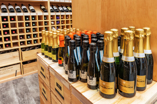 Small bottles of French wine in a wine store.